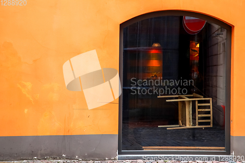 Image of Orange wall with window in Riga.