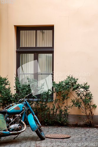 Image of Motorcycle next window in Riga town.