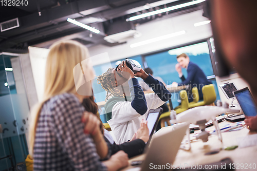 Image of Young Multiethnic Business team using virtual reality headset
