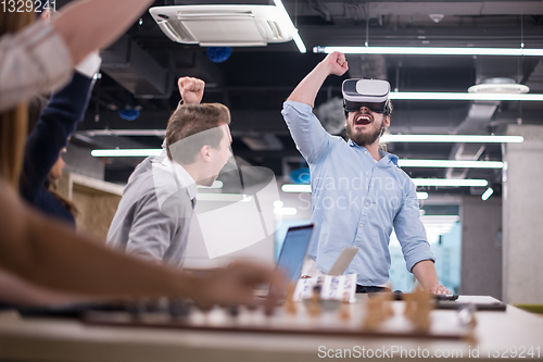 Image of Young Multiethnic Business team using virtual reality headset