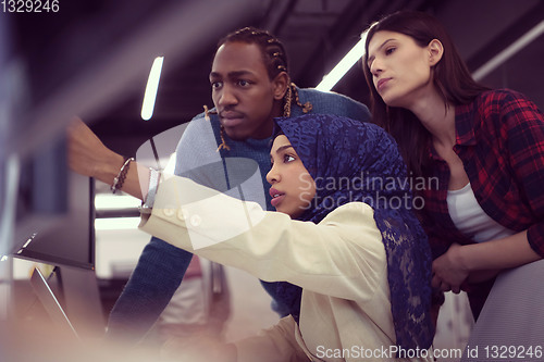Image of multiethnics team of software developers working together