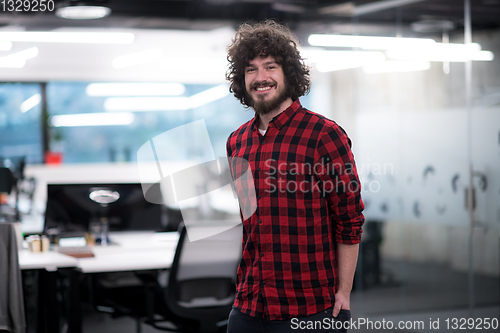 Image of Portrait of smiling male software developer