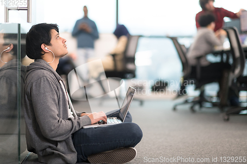 Image of software developer working on the floor