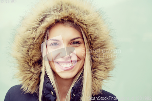 Image of portrait of young blonde girl wearing winter jacket