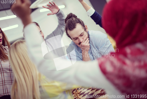 Image of multiethnic group of business people playing chess