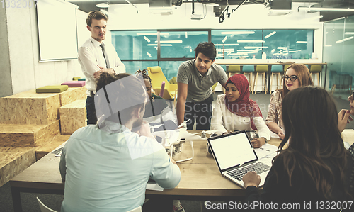 Image of multiethnic business team learning about drone technology