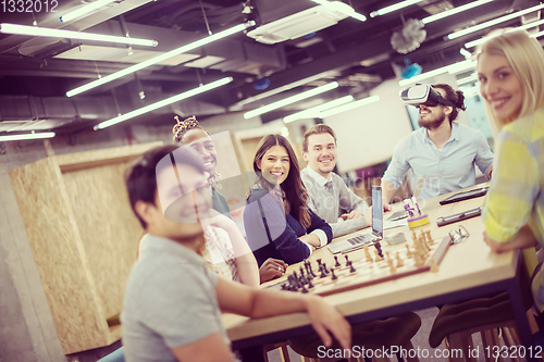 Image of Young Multiethnic Business team using virtual reality headset