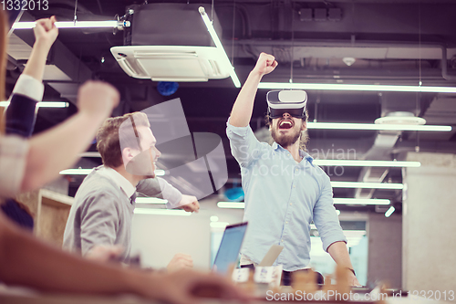 Image of Young Multiethnic Business team using virtual reality headset