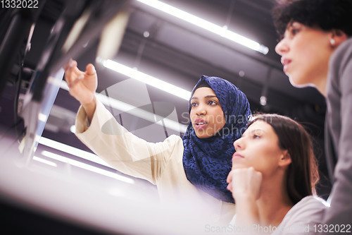 Image of multiethnics team of software developers working together