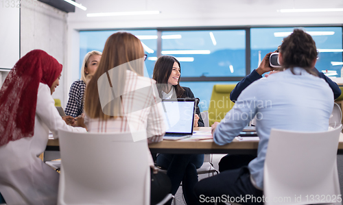 Image of Young Multiethnic Business team using virtual reality headset