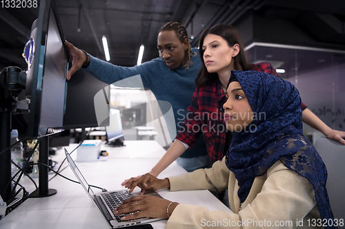 Image of multiethnics team of software developers working together