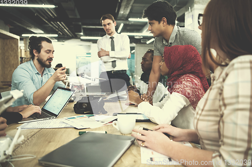 Image of multiethnic business team learning about drone technology