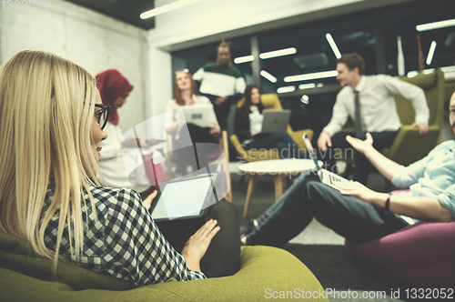 Image of blonde businesswoman using digital tablet