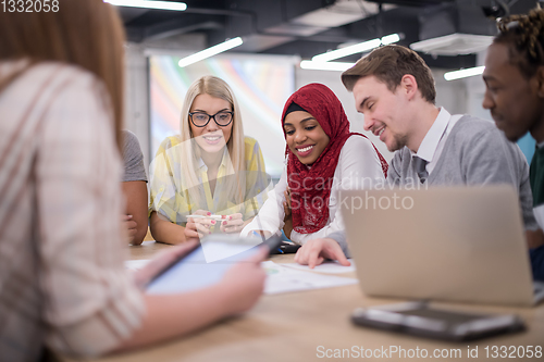 Image of Multiethnic startup business team having meeting