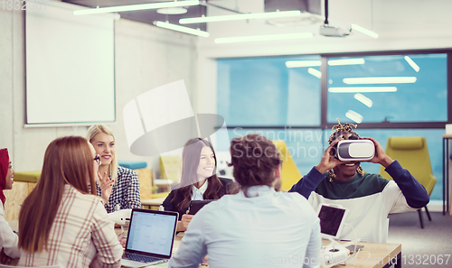 Image of Young Multiethnic Business team using virtual reality headset