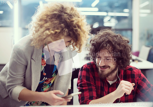 Image of software developers couple writing programming code