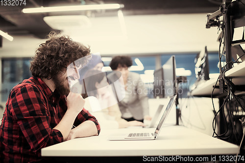 Image of young multiethnics team of software developers working together