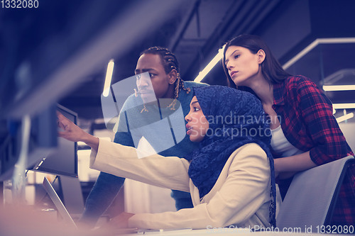 Image of multiethnics team of software developers working together