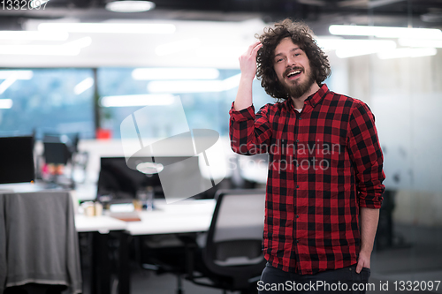 Image of Portrait of smiling male software developer