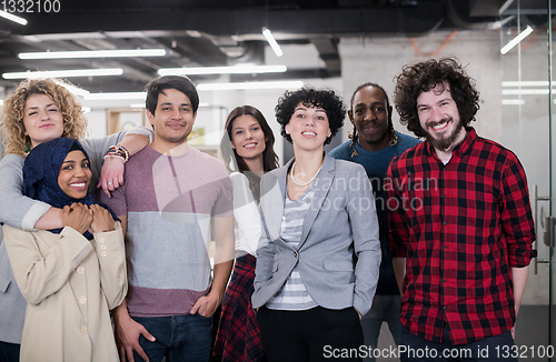 Image of portrait of young excited multiethnics business team