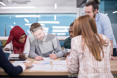 Image of Multiethnic startup business team having meeting