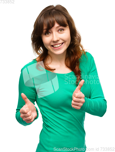 Image of Woman is showing thumb up gesture