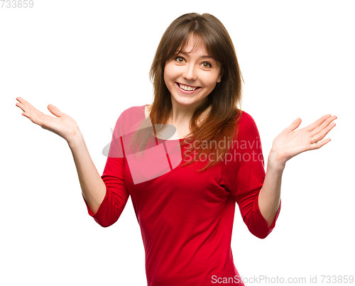 Image of Portrait of a young woman raised her hands up