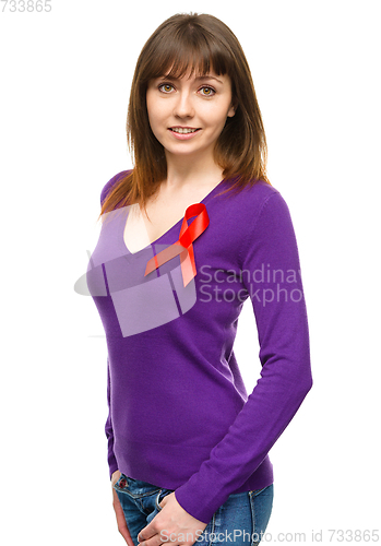 Image of Woman with the red awareness ribbon