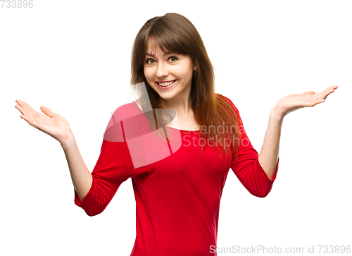 Image of Portrait of a young woman raised her hands up