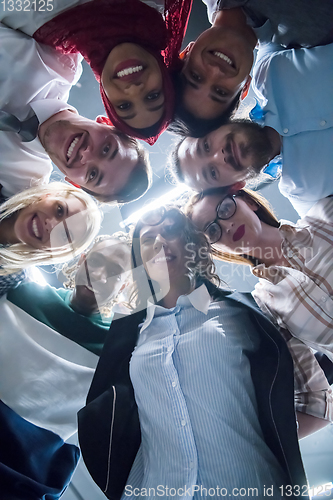 Image of multiethnic Group of young business people celebrating success