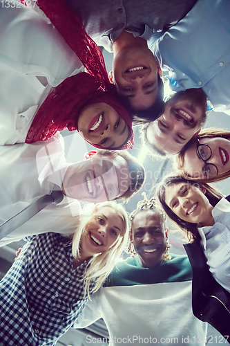 Image of multiethnic Group of young business people celebrating success