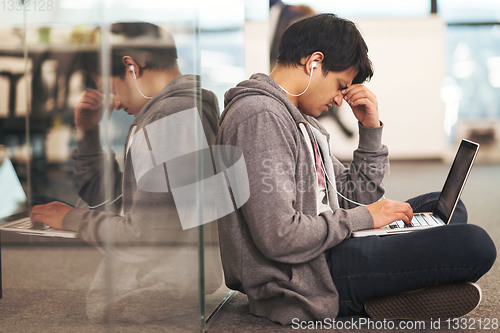 Image of software developer working on the floor