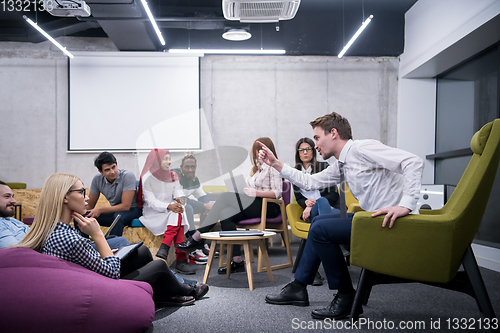 Image of Multiethnic startup business team having meeting