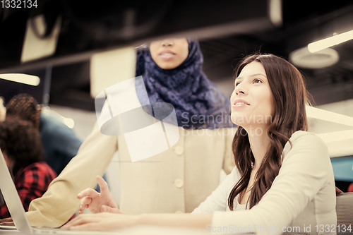 Image of multiethnics team of software developers working together