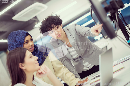 Image of multiethnics team of software developers working together