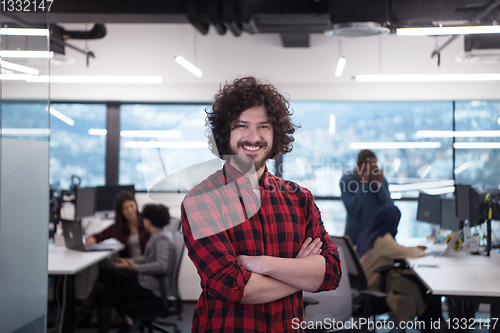 Image of Portrait of smiling male software developer