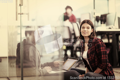 Image of software developers couple working on the floor