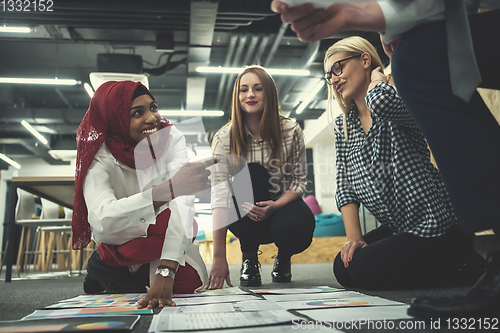 Image of black muslim woman having meeting with Multiethnic  startup busi