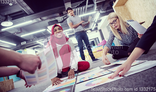 Image of black muslim woman having meeting with Multiethnic  startup busi