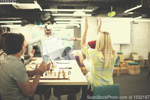 Image of Young Multiethnic Business team using virtual reality headset