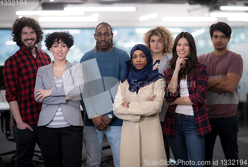 Image of portrait of young excited multiethnics business team