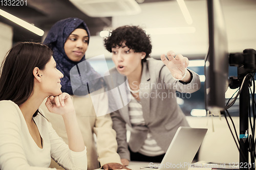 Image of multiethnics team of software developers working together