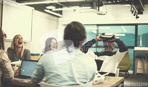 Image of Young Multiethnic Business team using virtual reality headset