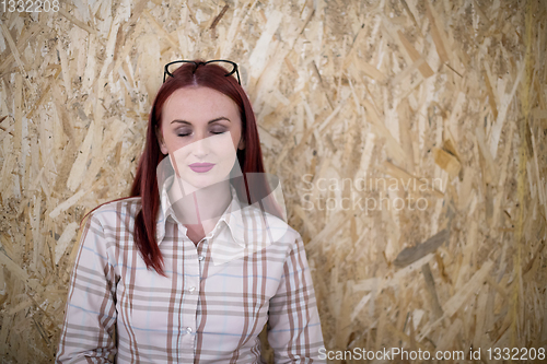 Image of portrait of young redhead business woman