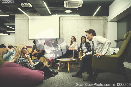 Image of Multiethnic startup business team having meeting