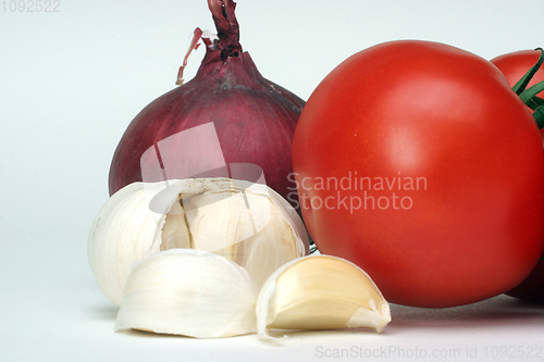 Image of Fresh garlic, onion and tomato