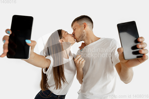 Image of Portrait of beautiful couple isolated on white studio background