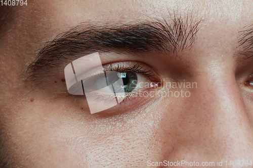 Image of Close-up portrait of young man isolated on grey studio background