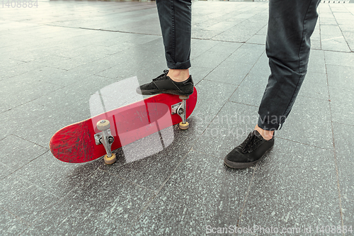 Image of Skateboarder at the city\'s street in sunny day