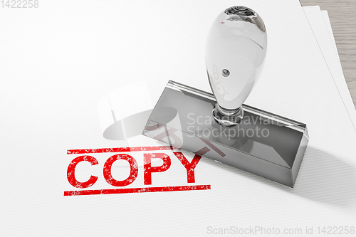 Image of red copy stamp on white paper background